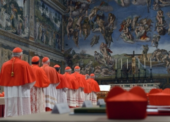 Cardinals from around the world line up in the Vatican's Sistine Chapel March 12, 2013, to take their oaths at the beginning of the conclave to elect a successor to Pope Benedict XVI. The following day, on the fifth ballot, they elected Cardinal Jorge Mario Bergoglio of Buenos Aires, Argentina, who chose the name Francis. (CNS photo/Vatican Media)