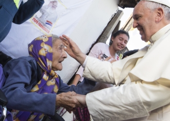 Pope Francis greets an elderly woman as he meets with people in Asuncion, Paraguay, in this July 12, 2015, file photo. The pope has chosen the theme, "In old age they will still bear fruit" (Psalm 92:15), for the second World Day for Grandparents and the Elderly July 24. (CNS photo/Paul Haring)