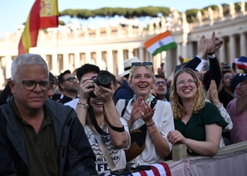 The crowd reacts in St. Peter’s Square at the Vatican on the second day of the conclave as white smoke billows from the chimney indicating a new pope has been elected. (OSV News photo/Dylan Martinez, Reuters)