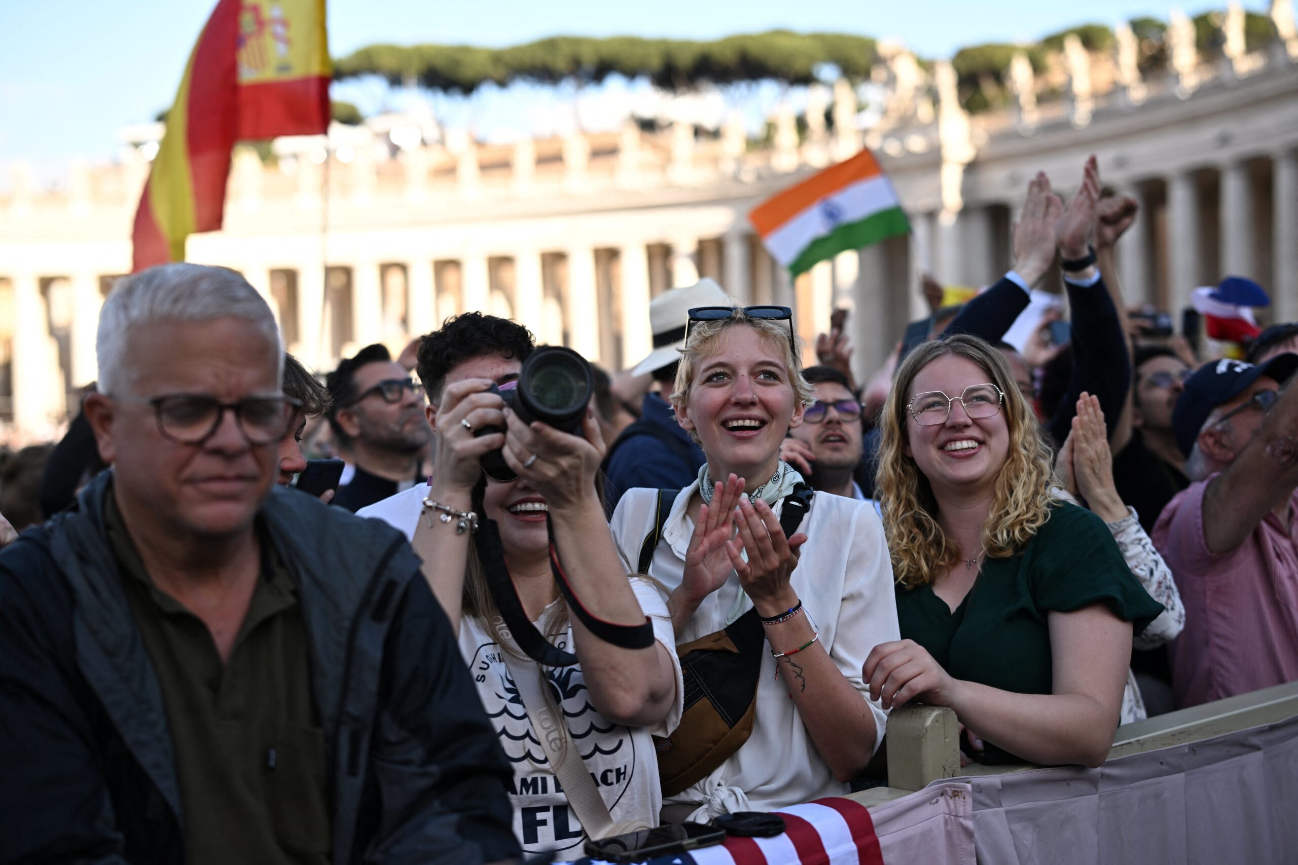 The crowd reacts in St. Peter’s Square at the Vatican on the second day of the conclave as white smoke billows from the chimney indicating a new pope has been elected. (OSV News photo/Dylan Martinez, Reuters)