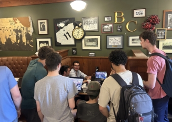 Students at Benedictine College in in Atchison, Kan., watch the announcement at a coffee shop May 8, 2025, after Chicago-born Cardinal Robert Francis Prevost was elected as the next pope. He chose the papal name Leo XIV. (OSV News photo/Jack Figge)