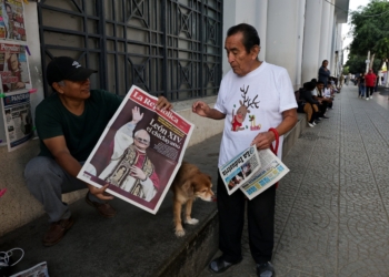 People hold newspapers in Chiclayo, Peru, May 9, 2025, reporting on the election of Pope Leo XIV, who is a dual U.S.-Peruvian citizen. Formerly Cardinal Robert F. Prevost, the prelate was elected pope May 8 at the Vatican, becoming the first American pope in history. As an Augustinian priest, then-Father Prevost spent many years as a missionary in Peru. (OSV News photo/Sebastian Castaneda, Reuters)