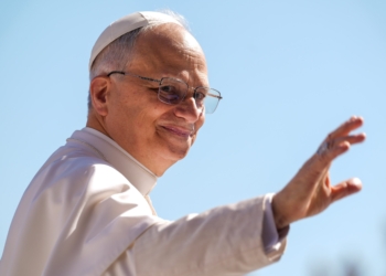 Pope Leo XIV greets visitors as he rides the popemobile to St. Peter’s Square at the Vatican May 28, 2025, ahead of his second weekly general audience. (CNS photo/Lola Gomez)