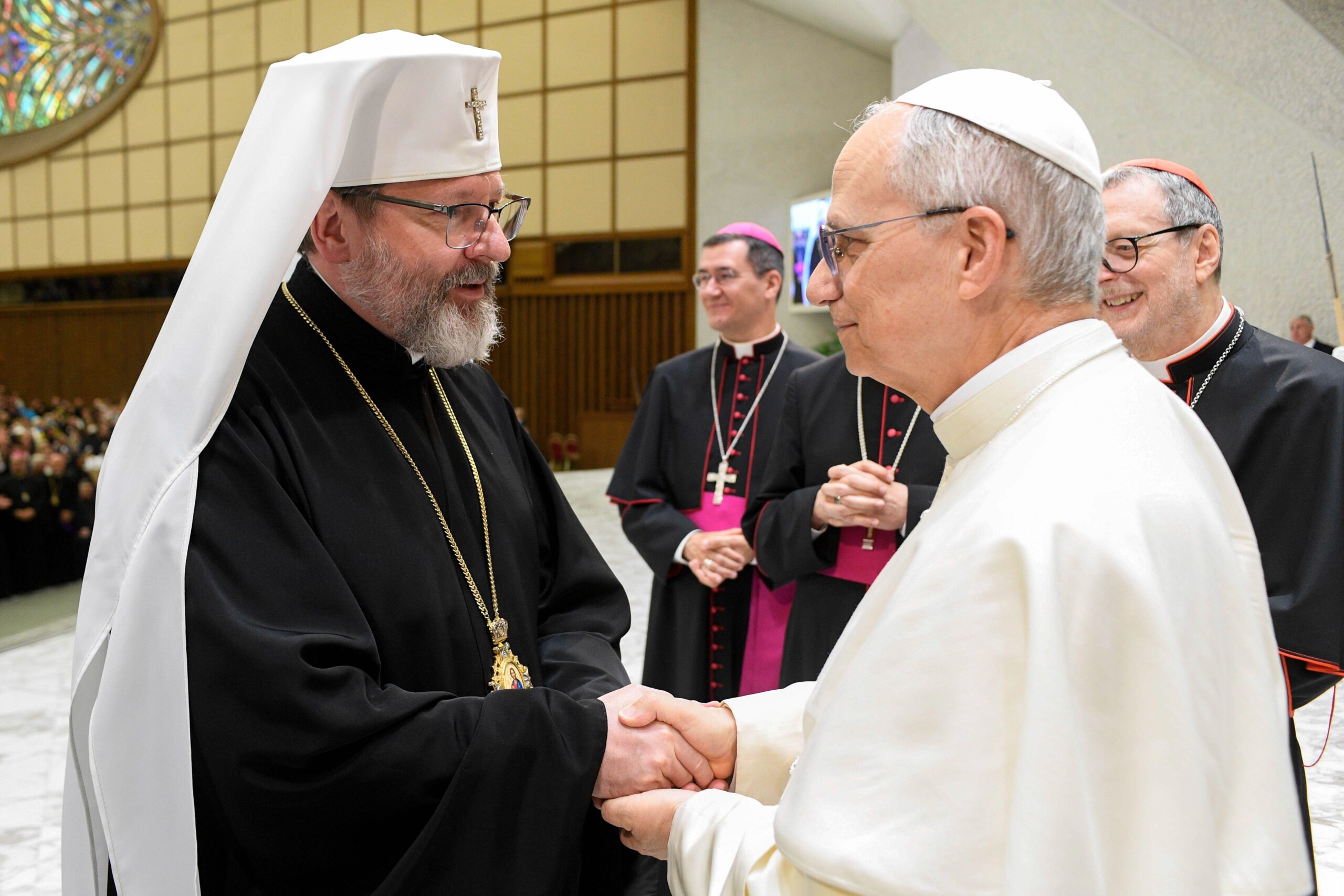 Pope Leo XIV greets Sviatoslav Shevchuk, Major Archbishop of Kyiv-Galicia, during a meeting with participants in the Jubilee of the Eastern Churches in the Paul VI Audience Hall at the Vatican as he tries on a traditional shawl May 14, 2025. (CNS photo/Vatican Media)