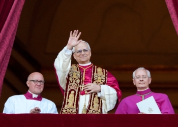 Pope Leo XIV, the former Cardinal Robert F. Prevost, waves to the crowds in St. Peter's Square at the Vatican after his election as pope May 8, 2025. The new pope was born in Chicago. (CNS photo/Lola Gomez)