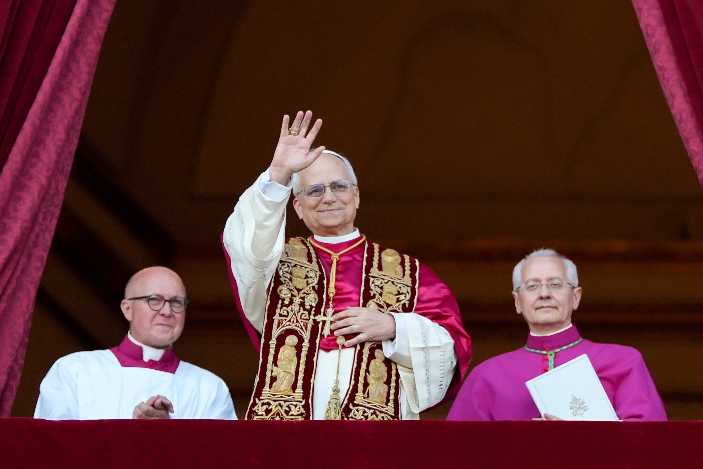 Pope Leo XIV, the former Cardinal Robert F. Prevost, waves to the crowds in St. Peter's Square at the Vatican after his election as pope May 8, 2025. The new pope was born in Chicago. (CNS photo/Lola Gomez)