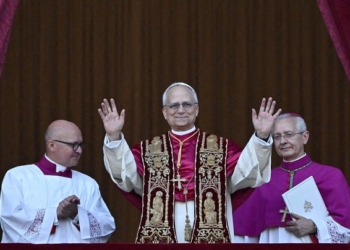 Cardinal Robert Francis Prevost, who has chosen the name Leo XIV, appears on the central balcony of St. Peter's Basilica at the Vatican May 8, 2025, following his election during the conclave. He became the first American pope in history. (OSV News photo/Dylan Martinez, Reuters)