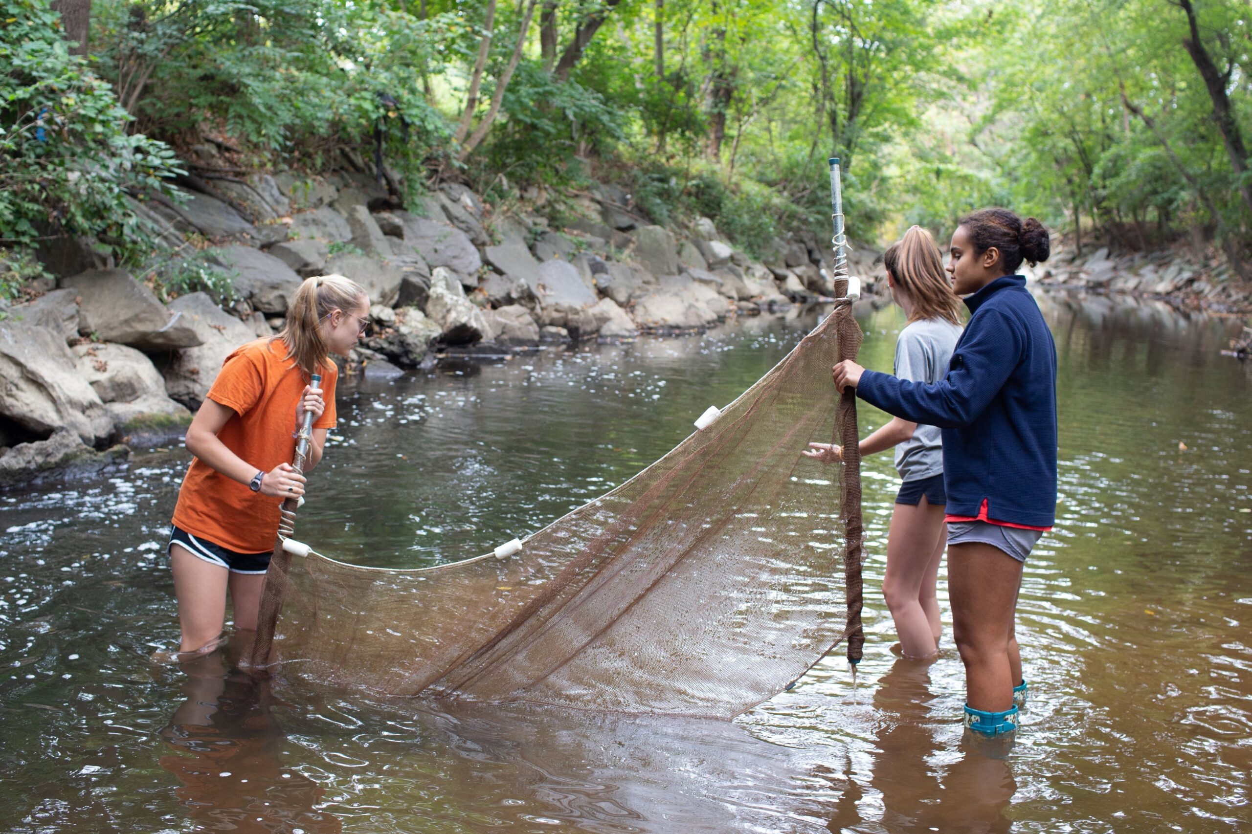 In a photo from fall 2019, students in an environmental studies class at Stone Ridge School of the Sacred Heart in Bethesda, Md., conduct a stream study in Rock Creek Park in Washington. (OSV News photo/Stone Ridge School of the Sacred Heart, courtesy Catholic Standard)
