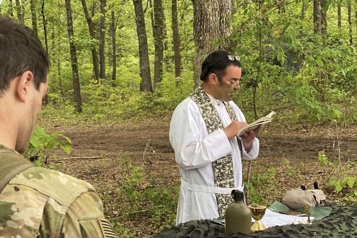 Father Peter Pomposello celebrates a field mass for soldiers  of the 101st Airborne Division at Fort Campbell, Ky., the summer of 2022. Father  Pomposello, a graduate of St. Joseph's Seminary in Yonkers, N.Y., who holds the rank of major and has been a chaplain since 2014, said his recruiting efforts have been "an eye-opener of how difficult it was to get a priest into the Army." (OSV News photo/courtesy Father Pomposello)
