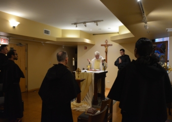 Augustinian Father John Lydon celebrates daily Mass at the Augustinian theologate chapel in Chicago's Hyde Park neighborhood May 23, 2025, while Brother Nicholas Anderson serves as acolyte. Father Lydon, the seminarians’ formation director, is a college classmate and longtime friend of Pope Leo XIV's from their missionary days in Peru. (OSV News photo/Simone Orendain)