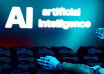 A message reading "AI artificial intelligence," a keyboard and robot hands are seen in this illustration created on Jan. 27, 2025. (OSV News photo/Dado Ruvic, Reuters)