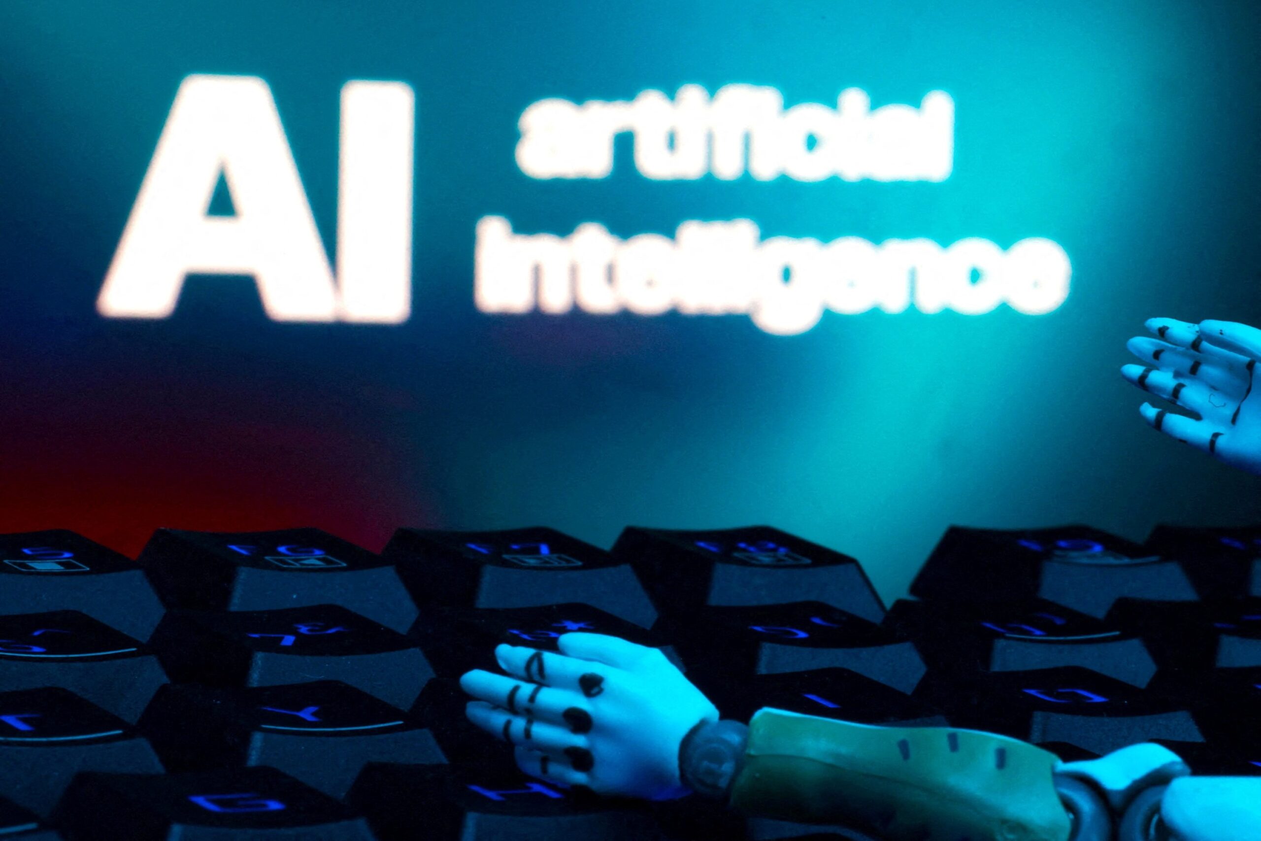 A message reading "AI artificial intelligence," a keyboard and robot hands are seen in this illustration created on Jan. 27, 2025. (OSV News photo/Dado Ruvic, Reuters)