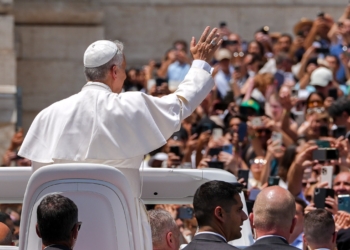 Pope Leo XIV greets visitors and pilgrims from the popemobile at the conclusion of his weekly general audience in St. Peter's Square at the Vatican June 11, 2025. (CNS photo/Lola Gomez)