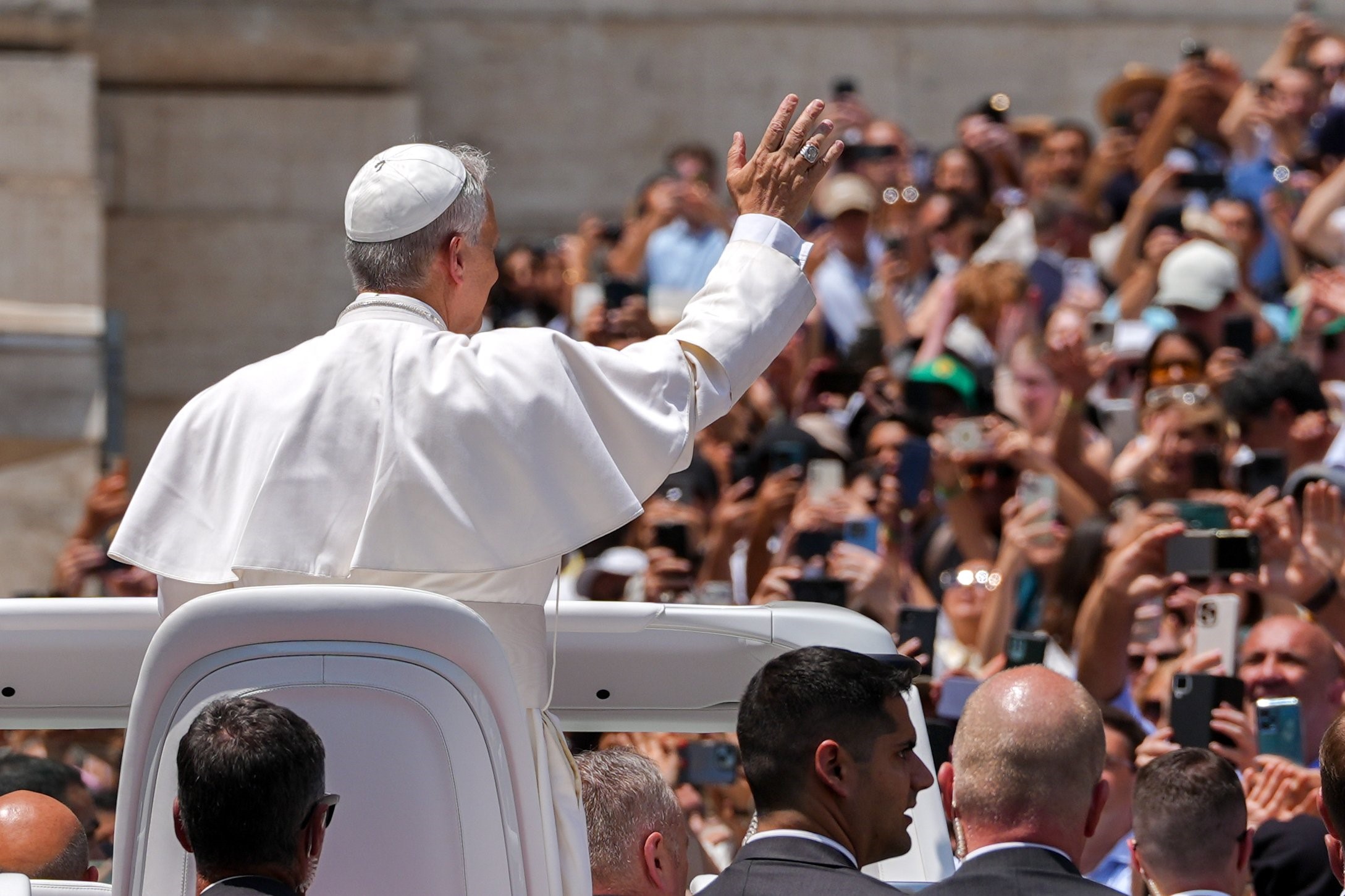 Pope Leo XIV greets visitors and pilgrims from the popemobile at the conclusion of his weekly general audience in St. Peter's Square at the Vatican June 11, 2025. (CNS photo/Lola Gomez)
