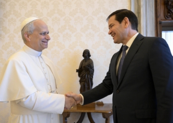 Pope Leo XIV shakes hands with Secretary of State Marco Rubio in the library of the Apostolic Palace at the Vatican May 19, 2025. (CNS photo/Vatican Media)
