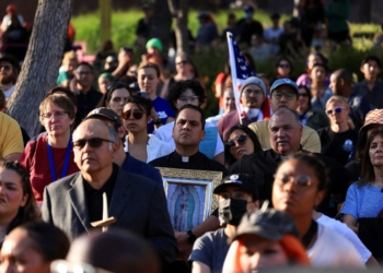 A member of the clergy holding an image of Our Lady of Guadalupe attends a vigil in Grand Park in downtown Los Angeles June 10, 2025, as protests against federal immigration sweeps continue. (OSV News photo/David Swanson, Reuters)