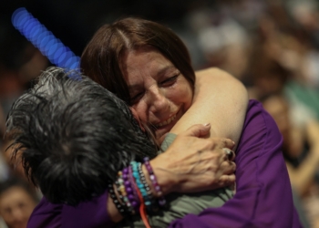 Consuelo Garcia del Cid, 66, a survivor and advocate for the cause, hugs an assistant before a ceremony in Madrid June 9, 2025, by the Spanish Confederation of Religious Entities (CONFER) to apologize to the survivors of Catholic moral rehabilitation institutes in Spain, where thousands of women and girls suffered harsh treatment during Francisco Franco's dictatorship. (OSV News photo/Juan Medina, Reuters)