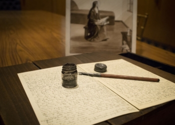 The writing case, pen and inkwell used by St. Therese of Lisieux are seen with a facsimile of handwritten pages from the saint's "Story of a Soul." Catholics nationwide are invited to encounter St. Thérèse of Lisieux in a special way during an upcoming visit of her relics to the United States this fall beginning Oct. 1, the feast day of St. Thérèse, and concludes Dec. 8, the solemnity of the Immaculate Conception of the Blessed Virgin Mary. (OSV News photo/Nancy Phelan Wiechec)