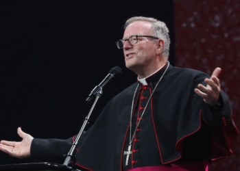 Bishop Robert E. Barron of Winona-Rochester, Minn., speaks during the July 20, 2024, revival night of the National Eucharistic Congress at Lucas Oil Stadium in Indianapolis. Bishop Barron, a member of the U.S. Religious Liberty Commission, has filed an amicus brief in a case contesting Washington State's law that compels priests, as mandated reporters, to violate the seal of the confessional and reveal suspected abuse to authorities. (OSV News photo/Bob Roller)
