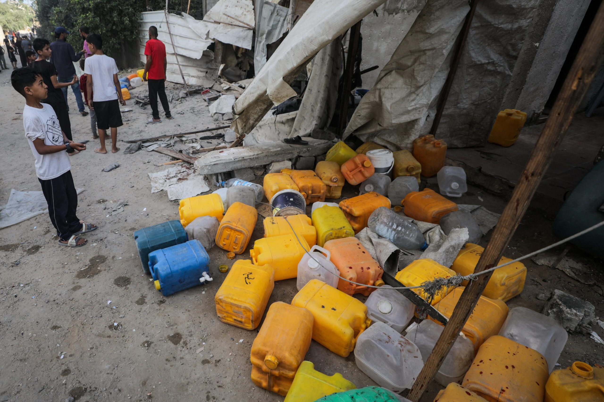A boy looks at the site of an Israeli airstrike in Nuseirat in the central Gaza Strip July 13, 2025, that killed Palestinians gathering to collect water from a distribution point, according to medics. (OSV News photo/Reuters)