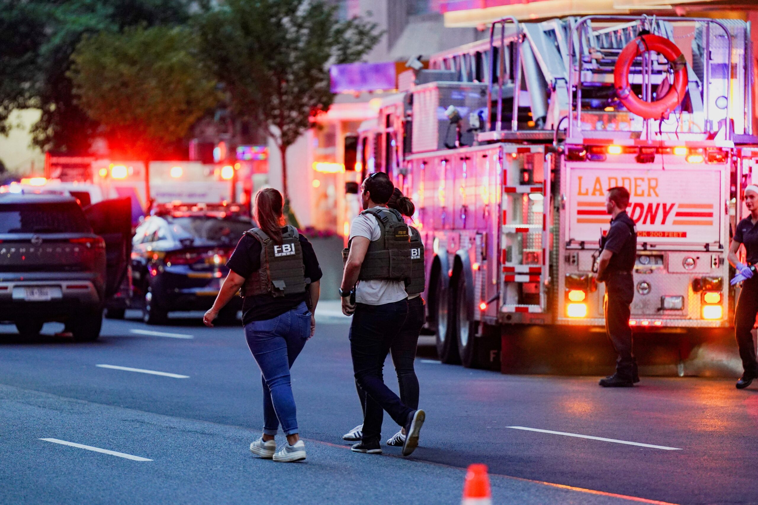 FBI agents investigate near a New York City Fire Department response vehicle during a reported active shooter situation in the Manhattan borough of New York City July 28, 2025. The shooting at a midtown Manhattan office building left at least three people dead, including an off-duty New York City police officer, sources told the The Associated Press. (OSV News Photo/Bing Guan, Reuters)
