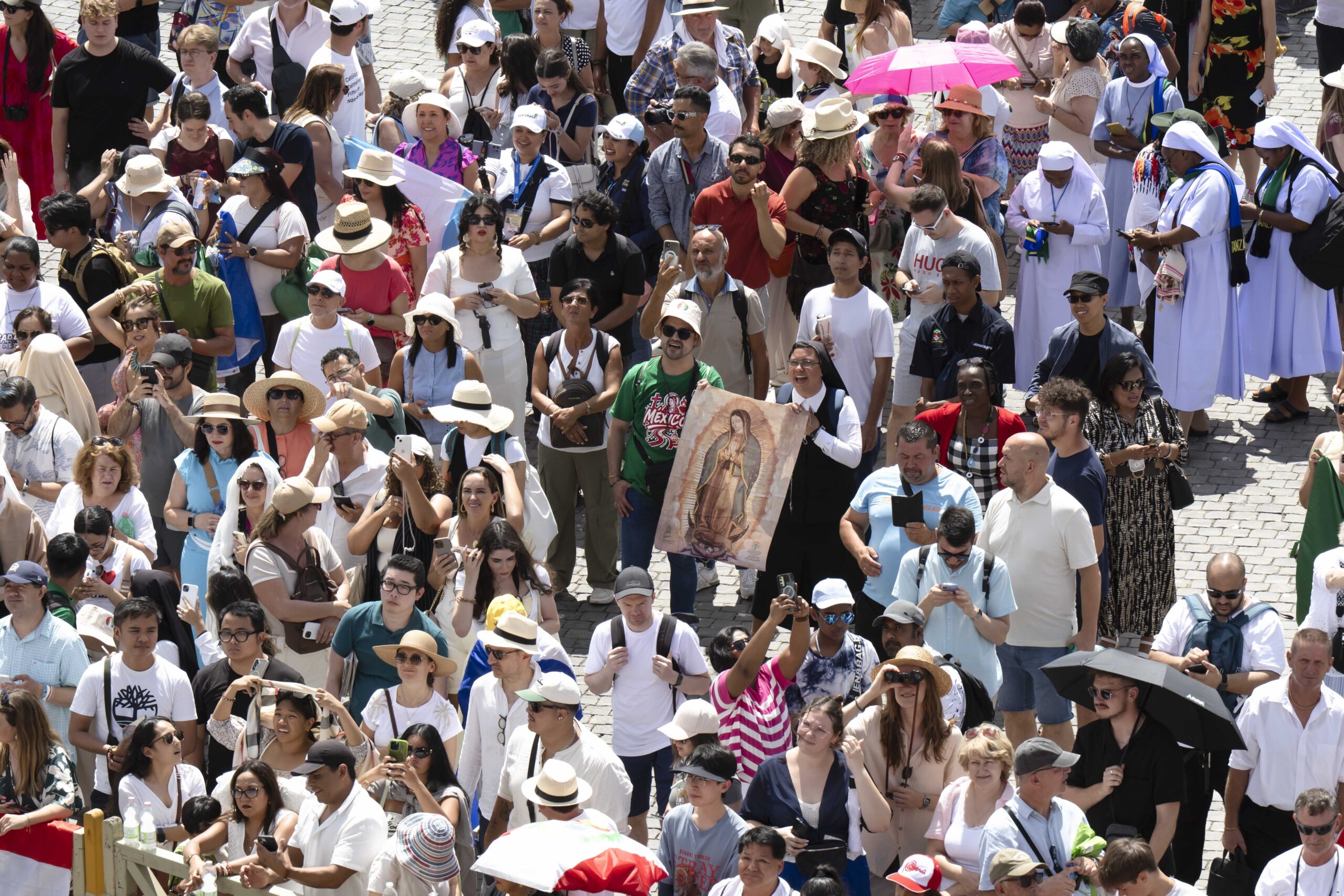 Pilgrims hold an image of Our Lady of Guadalupe as they gather in St. Peter’s Square at the Vatican for the Angelus with Pope Leo XIV July 27, 2025. (CNS photo/Vatican Media)
Pope Leo XIV leads the Angelus from the window of the Apostolic Palace overlooking St. Peter’s Square at the Vatican July 27, 2025. (CNS photo/Vatican Media)
Pope Leo XIV greets pilgrims after leading the Angelus in St. Peter’s Square at the Vatican July 27, 2025. (CNS photo/Vatican Media)