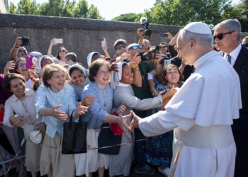 Pope Leo XIV greets people as he arrives in Castel Gandolfo, Italy, July 6, 2025, after reciting the Angelus at the Vatican. The pope will stay in Castel Gandolfo for his customary retreat through July 20. (CNS photo/Vatican Media)