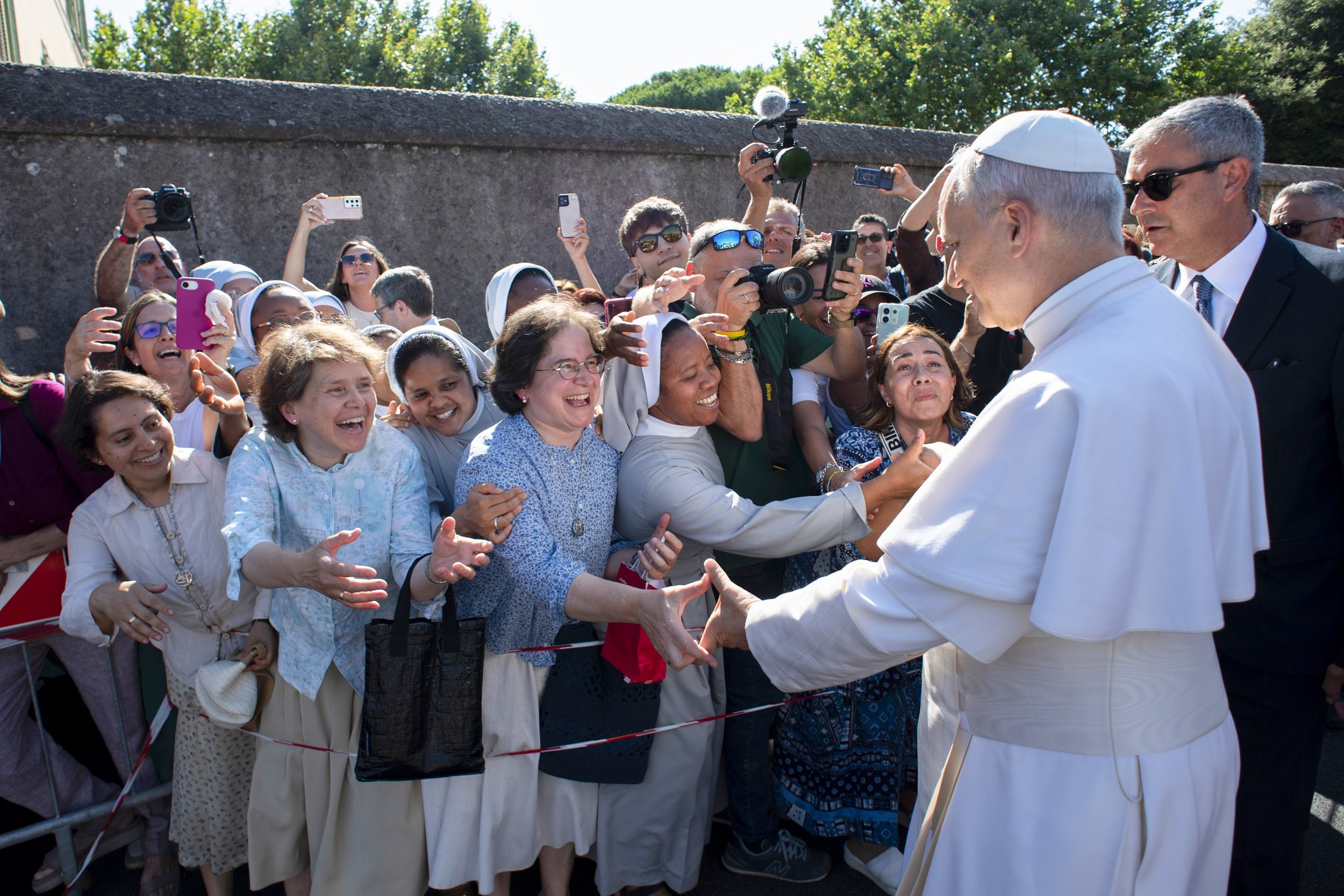 Pope Leo XIV greets people as he arrives in Castel Gandolfo, Italy, July 6, 2025, after reciting the Angelus at the Vatican. The pope will stay in Castel Gandolfo for his customary retreat through July 20. (CNS photo/Vatican Media)