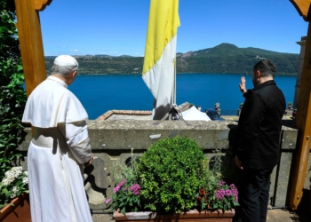 Pope Leo XIV and Ukrainian President Volodymyr Zelenskyy wave from the papal villa in Castel Gandolfo, Italy, during their meeting July 9, 2025. (CNS photo/Vatican Media)