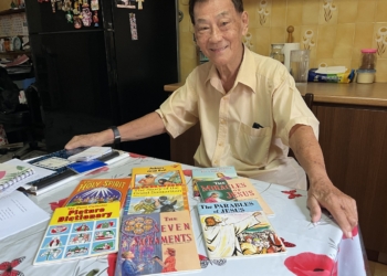 Andrew Goh, an 88-year-old catechist poses for a photo at his home in Singapore July 2, 2025. Goh uses children’s books to teach catechism to the elderly. (OSV News photo/Christopher Khoo)
