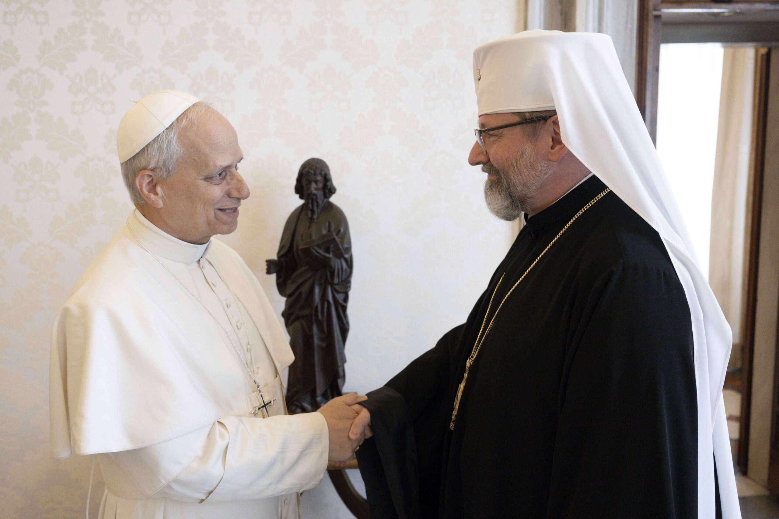 Pope Leo XIV greets Major Archbishop Sviatoslav Shevchuk of Kyiv-Halych, head of the Ukrainian Greek Catholic Church, in the library of the Apostolic Palace at the Vatican May 15, 2025. (CNS photo/Vatican Media)