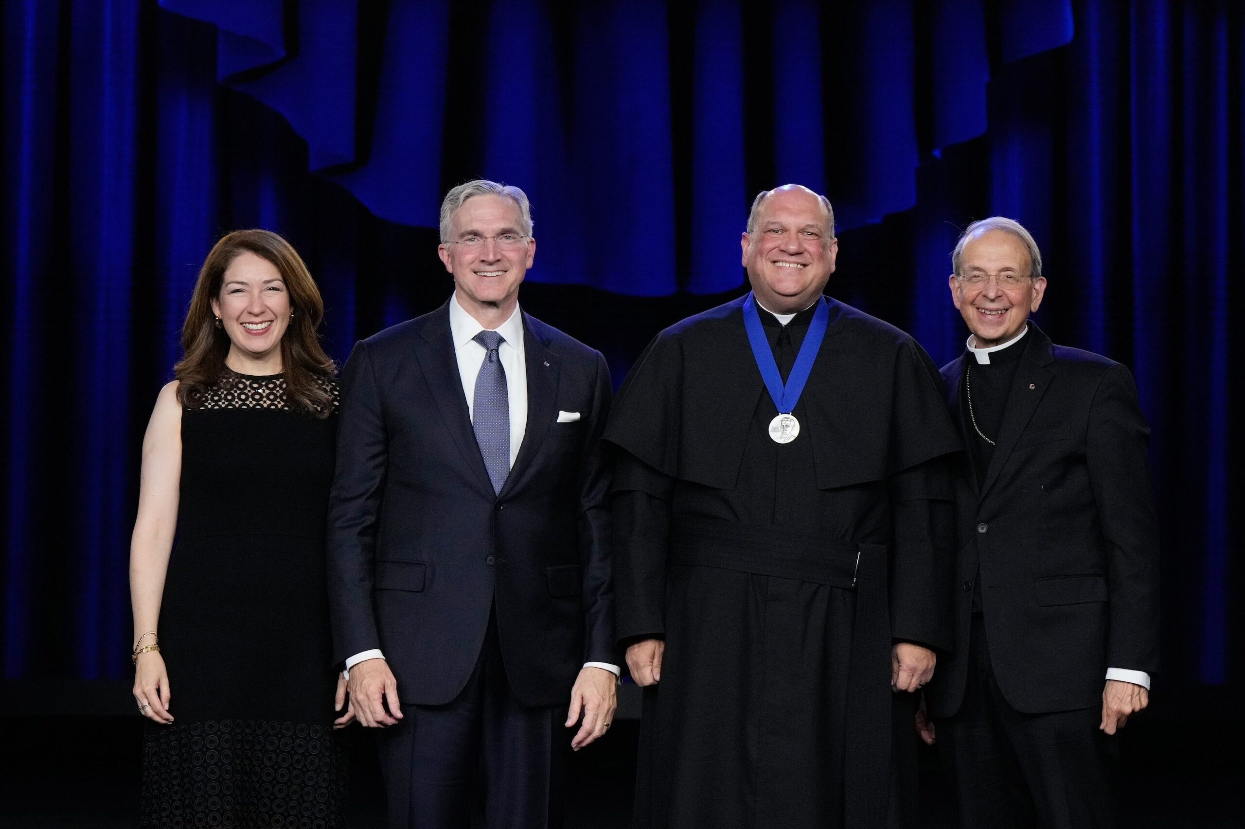 Pallottine Father Frank Donio, state chaplain of the District of Columbia, stands with Supreme Knight Patrick Kelly, his wife, Vanessa, and Supreme Chaplain Archbishop William Lori of Baltimore after receiving the Blessed Michael McGivney Medal during the annual Supreme Knight’s Awards Session in Washington Aug. 4, 2025. (OSV News photo/Paul Haring, Knights of Columbus)