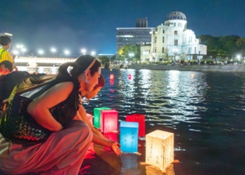 People release paper lanterns on the Motoyasu River facing the gutted Atomic Bomb Dome in Hiroshima, Japan, Aug. 6, 2025, on the 80th anniversary of the United States dropping the atomic bomb on Hiroshima. (OSV News photo/Mihoko Owada, Catholic Standard)
