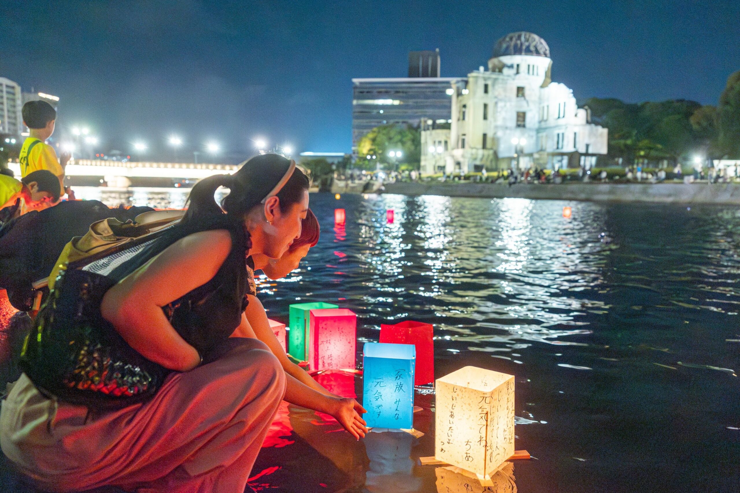 People release paper lanterns on the Motoyasu River facing the gutted Atomic Bomb Dome in Hiroshima, Japan, Aug. 6, 2025, on the 80th anniversary of the United States dropping the atomic bomb on Hiroshima. (OSV News photo/Mihoko Owada, Catholic Standard)