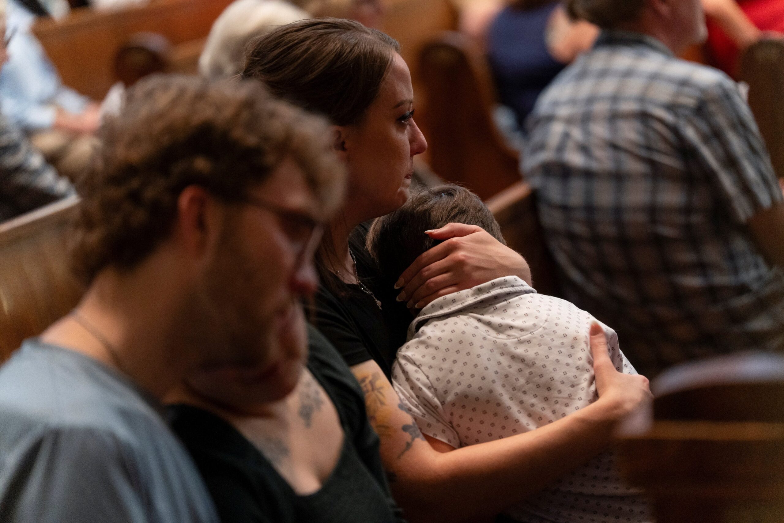 A woman holds a child during an interfaith prayer service for the Annunciation Catholic community, following a shooting at Annunciation Catholic Church on Wednesday, at the Basilica of St. Mary in Minneapolis, Minn., August 28, 2025. (OSV News photo/Tim Evans, Reuters)