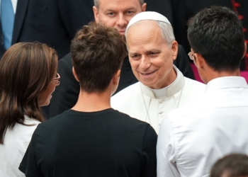Pope Leo XIV greets people in the Paul VI Audience Hall at the conclusion of his weekly general audience at the Vatican Aug. 20, 2025. (CNS photo/Lola Gomez)