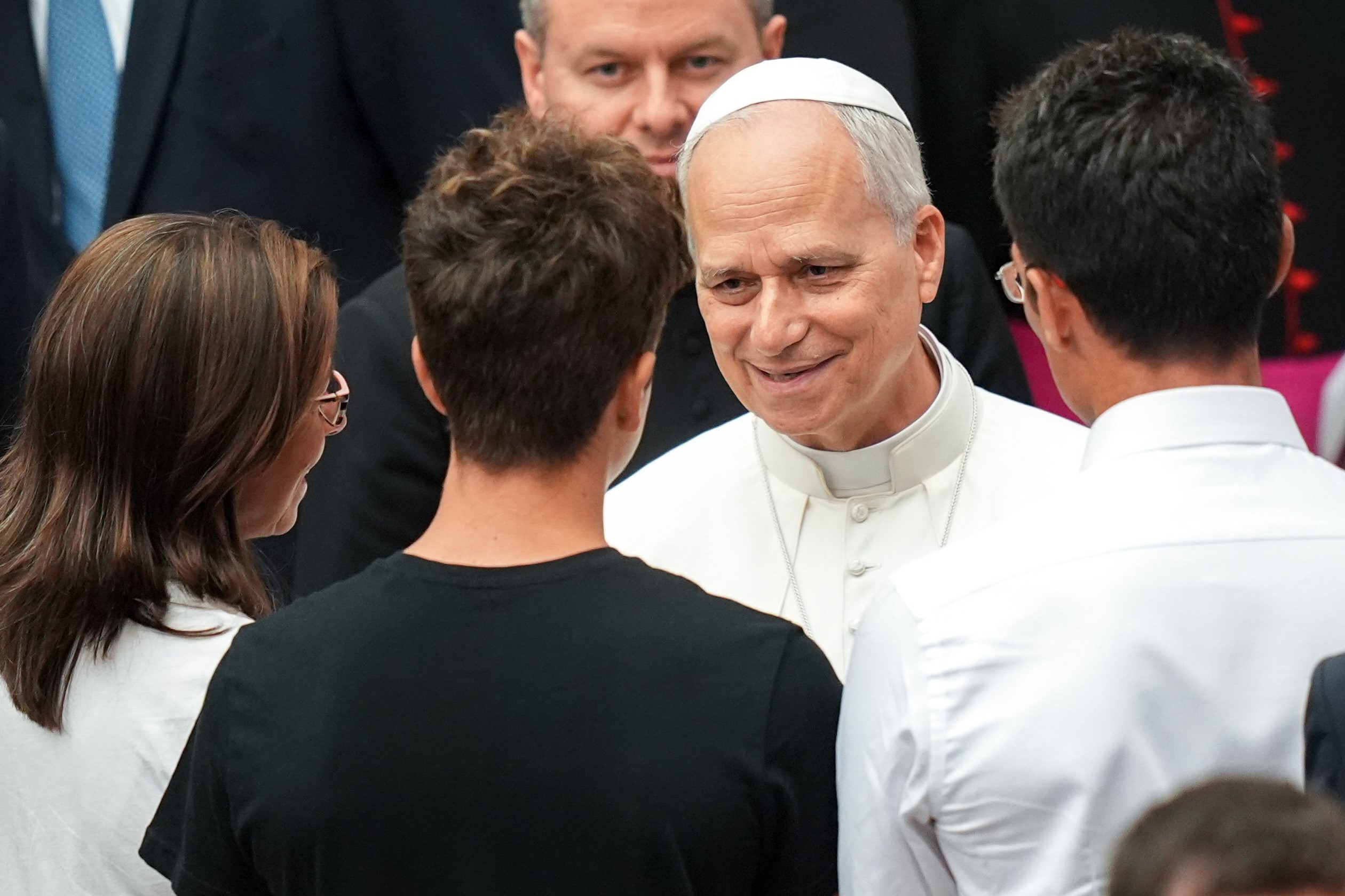 Pope Leo XIV greets people in the Paul VI Audience Hall at the conclusion of his weekly general audience at the Vatican Aug. 20, 2025. (CNS photo/Lola Gomez)