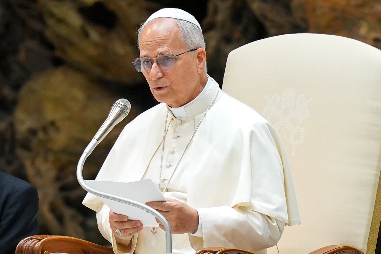 Pope Leo XIV talks to visitors during his weekly general audience in the Paul VI Audience Hall at the Vatican Aug. 20, 2025. (CNS photo/Lola Gomez)