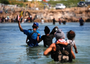 A group of migrants cross the Rio Grande in an attempt to seek asylum into the U.S., as seen from Piedras Negras, Mexico, Sept. 28, 2023. (OSV News photo/Daniel Becerril, Reuters)
