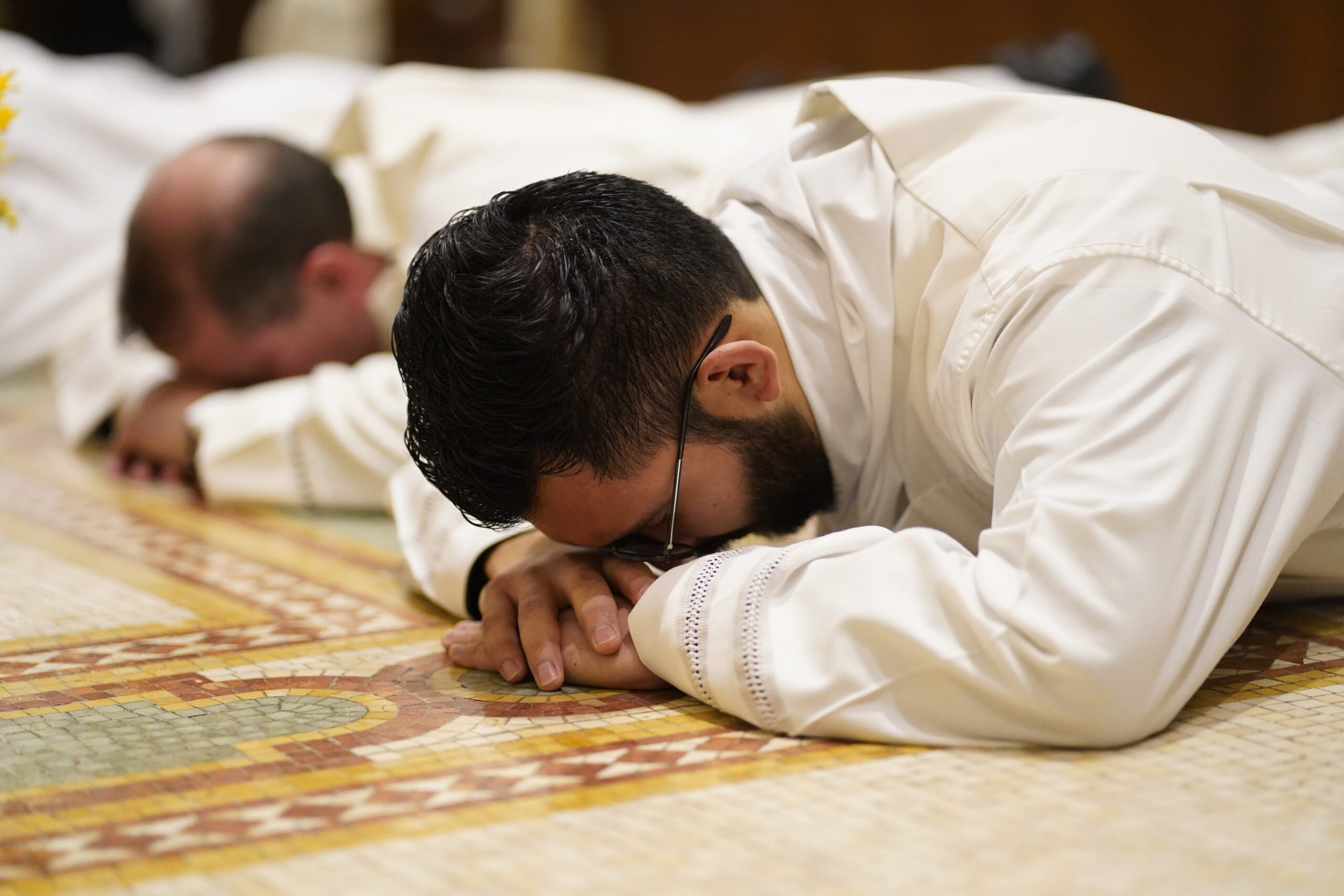 Alvaro Morales, a Diocese of Brooklyn, N.Y. seminarian, lies prostrate in the sanctuary during his ordination to the transitional diaconate at St. Joseph's Seminary in Yonkers, N.Y., Nov. 9, 2024. Eight seminarians completing their preparation for the priesthood were ordained at the Mass: five for the Diocese of Brooklyn and three for Archdiocese of New York. The liturgy was celebrated on the final day of National Vocations Awareness Week. (OSV News photo/Gregory A. Shemitz)
