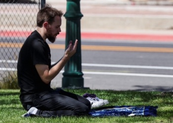 A man prays at Utah Valley University where U.S. right-wing activist Charlie Kirk was shot during an event in Orem Sept. 10, 2025. (OSV News photo/Jim Urquhart, Reuters)