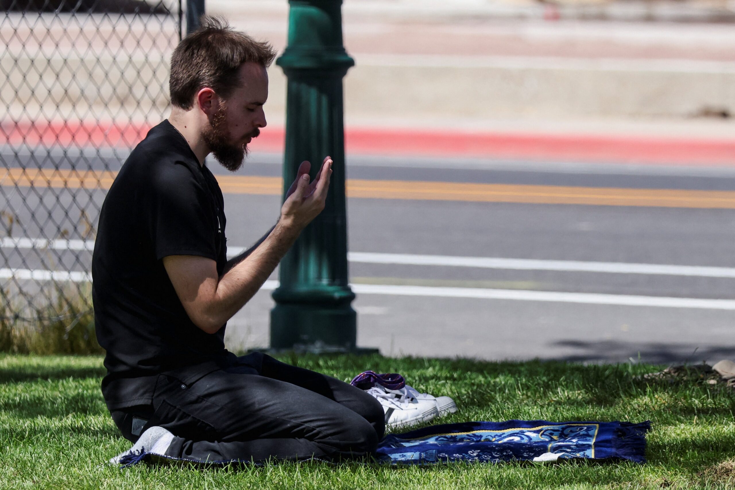 A man prays at Utah Valley University where U.S. right-wing activist Charlie Kirk was shot during an event in Orem Sept. 10, 2025. (OSV News photo/Jim Urquhart, Reuters)