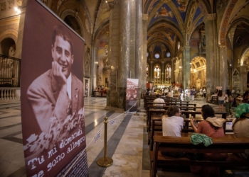 Pilgrims visit the Basilica of Santa Maria sopra Minerva in Rome July 31, 2025, where the relics of Blessed Pier Giorgio Frassati have been brought for the Jubilee of Youth. Banners inside the basilica feature images and quotes from the blessed, whose casket containing his remains were brought from his tomb in Turin for veneration. (CNS photo/Pablo Esparza)