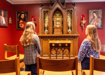 Two women pray at the new St. Pier Giorgio Frassati Chapel located next to the office of Immaculate Conception Parish in Washington Aug. 22, 2025. The new chapel is named for the new saint who was canonized by Pope Leo XIV on Sept. 7, 2025. St. Pier Giorgio, an Italian young adult who died in 1925, was known for his devotion to the Eucharist and service to those in need. The St. Pier Giorgio Frassati Chapel is open many hours every day for private prayer and is open for select hours of Eucharistic Exposition during the week. (OSV News photo/Mihoko Owada, Catholic Standard)