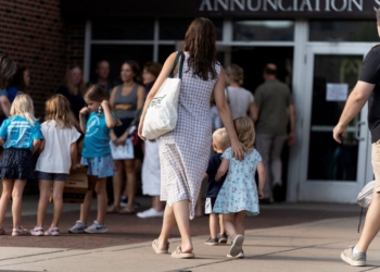 Parishioners arrive for  the first Mass at Annunciation Church in Minneapolis Aug. 30, 2025, which is a home to an elementary school and was the scene of a shooting. The shooter opened fire with a rifle through the windows of the school's church and struck children attending Mass Aug. 27 during the first week of school, killing two and wounding 18 others. (OSV News photo/Tim Evans, Reuters)