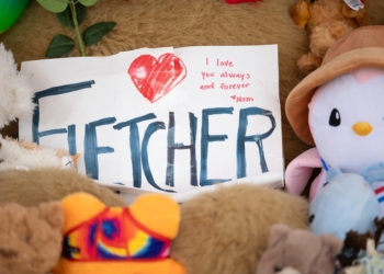 A memorial for Fletcher Merkel, who died during the shooting at Annunciation church in Minneapolis, Minn., Aug. 27 is on display in front of the doors of Annunciation church. His funeral occurred Sept. 7 at Mt. Olivet Lutheran Church in Minneapolis. (OSV News photo/David Hrbacek, The Catholic Spirit)