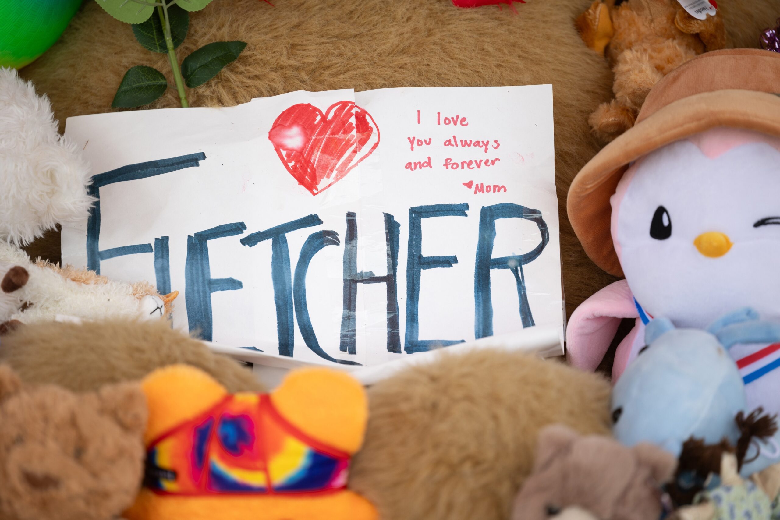A memorial for Fletcher Merkel, who died during the shooting at Annunciation church in Minneapolis, Minn., Aug. 27 is on display in front of the doors of Annunciation church. His funeral occurred Sept. 7 at Mt. Olivet Lutheran Church in Minneapolis. (OSV News photo/David Hrbacek, The Catholic Spirit)