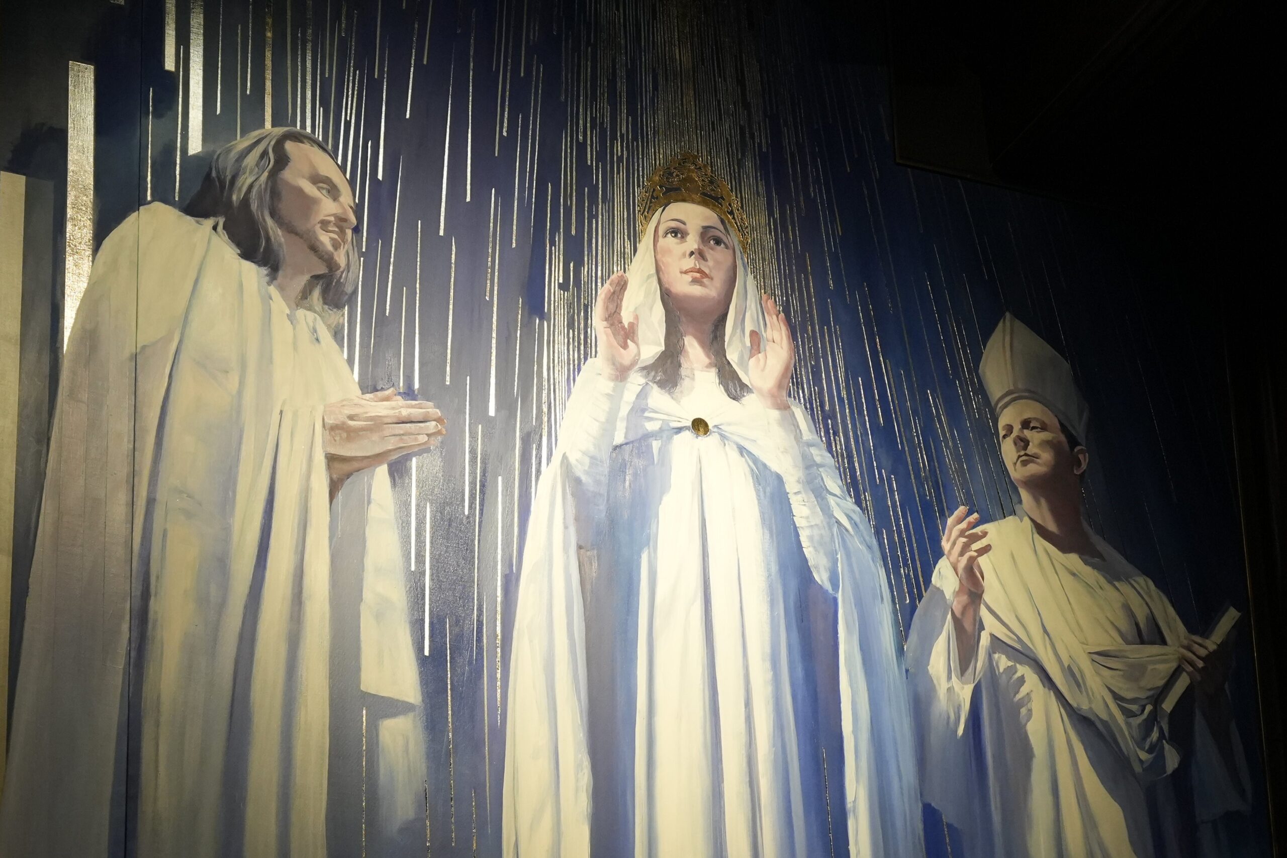 St. Joseph, Our Lady of Knock and St. John the Evangelist are depicted in a section of a 25-foot-high, four-panel mural as seen in the narthex of St. Patrick's Cathedral in New York City Sept. 18, 2025, the date of the artwork's formal unveiling. The mural depicts the 1879 Marian apparition in Knock, Ireland; people connected to the Catholic heritage and immigration history of New York City and State; and first responders who serve the metropolitan area. (OSV News photo/Gregory A. Shemitz)