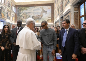 Pope Leo XIV greets American singer Pharrell Williams during a meeting on human fraternity in the Clementine Hall at the Vatican Sept. 12, 2025. (CNS photo/Vatican Media)