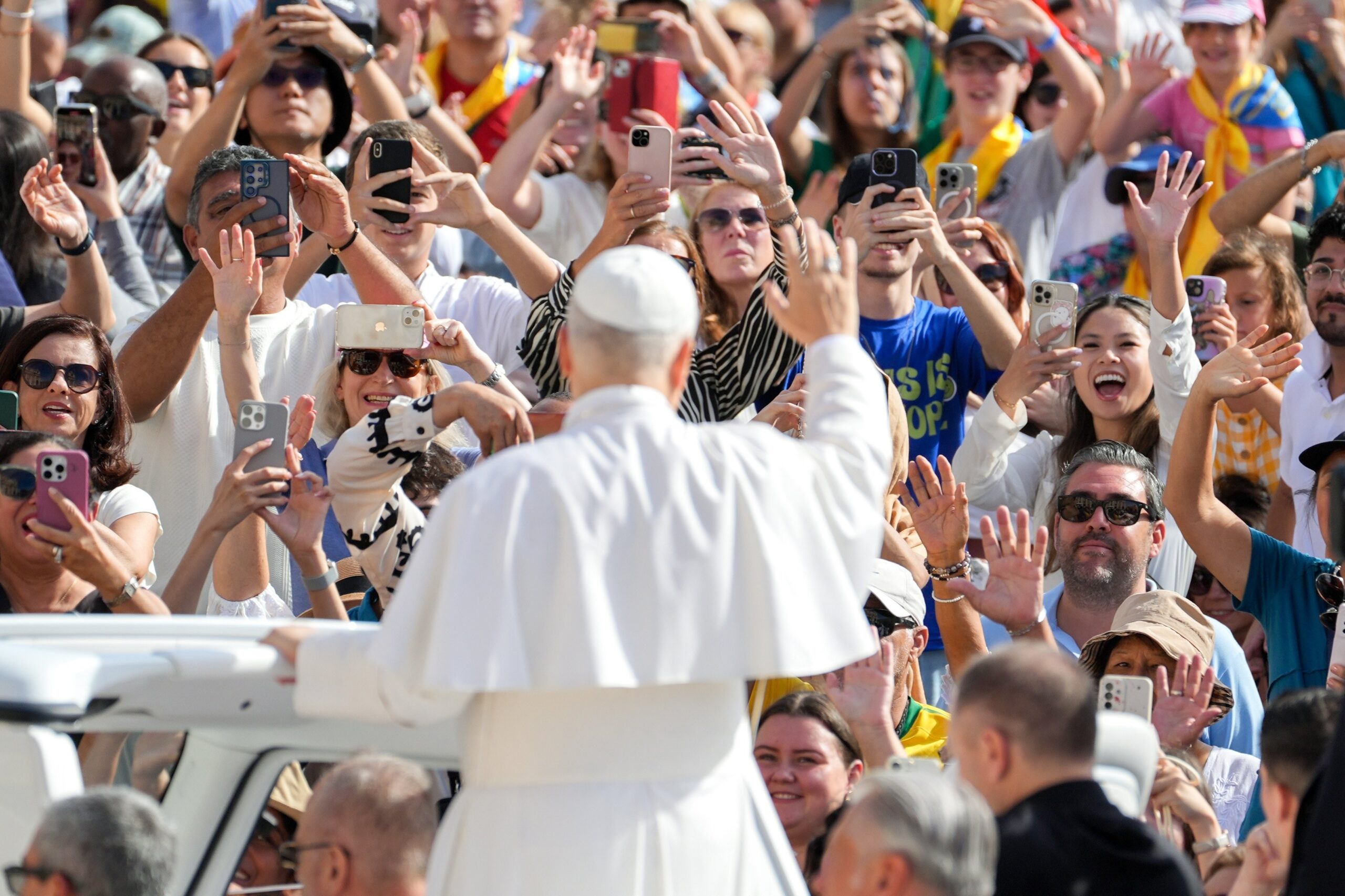 Pope Leo XIV greets visitors and pilgrims from the popemobile as he rides around St. Peter's Square at the Vatican before his weekly general audience Sept. 3, 2025. (CNS photo/Lola Gomez)